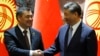 Kyrgyz President Sadyr Japarov (left) and Chinese President Xi Jinping(file photo)