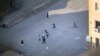 Children are playing soccer in a schoolyard in the capital of Kosovo Pristina