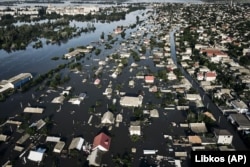 Затоплені вулиці Херсону внаслідок знищення Каховської ГЕС, 7 червня 2023 року