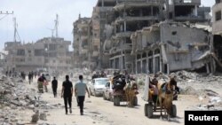 Raseljeni Palestinci idu prema Džabaliji nakon poziva Izraelske vojske na evakuaciju, 14. maj 2024.