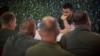 Ukrainian President Volodymyr Zelenskiy with servicemen during his visit earlier this week to the headquarters of brigades at the front line near Soledar in the Donetsk region.