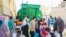 Tehran residents line up for water on June 13. 