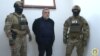 Former senior Nagorno-Karabakh official Ruben Vardanian (center) in Azerbaijani custody in Baku.