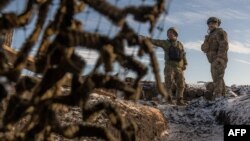 Українські бійці 41-ї бригади стоять на передовій, під Куп'янськом Харківської області, 23 січня 2024 року під час російського вторгнення в Україну