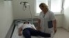 Bosnia and Herzegovina, Bijeljina, blind woman, victims of domestic violence at work as a physicals therapist 
