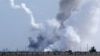 На снимке виден дым, поднимающийся над территорией после предполагаемого взрыва в селе Майское, 16 августа 2022 года