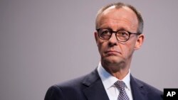 Friedrich Merz addresses the media in Berlin, April 9, 2025.