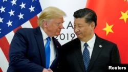 Američki predsednik Donald Tramp i kineski lider Si Đinping na samitu lidera G20 u Japanu 24. novembra 2019, kada su se poslednji put sastala dva lidera.