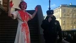 Russian Artist Doused In Fake Blood Protests Against War Russian Artist Doused In Fake Blood Protests Against War