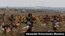 Rows of fresh graves multiplied as Russian forces pressed to capture the strategic Azov Sea port city of Mariupol in early 2022.