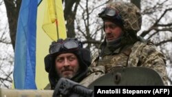 Українські військові поблизу лінії фронту на Ізюмському напрямку, квітень 2022 року