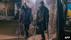 A photo released on May 10 by the Azov Battalion shows two injured Ukrainian soldiers inside the Azovstal steelworks in Mariupol.