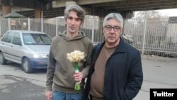 Iranian rights activist Arash Sadeghi (left) poses with his father on January 21.