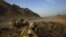U.S. Marines keep watch on a hilltop during a patrol in Helmand Province on September 21.