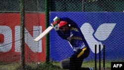 د ګجرات ټايټنز لوبډلې افغان لوبغاړی راشد خان د تمرین پرمهال - پخوانی انځور.