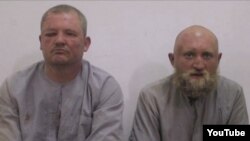 Россияне, предположительно плененные в Сирии. Григорий Цуркану – слева