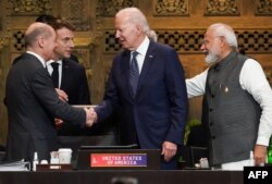 Джо Байден, Еммануель Макрон, Олаф Шольц і Нарендра Моді на саміті G20 на Балі. 15 листопада 2022 року