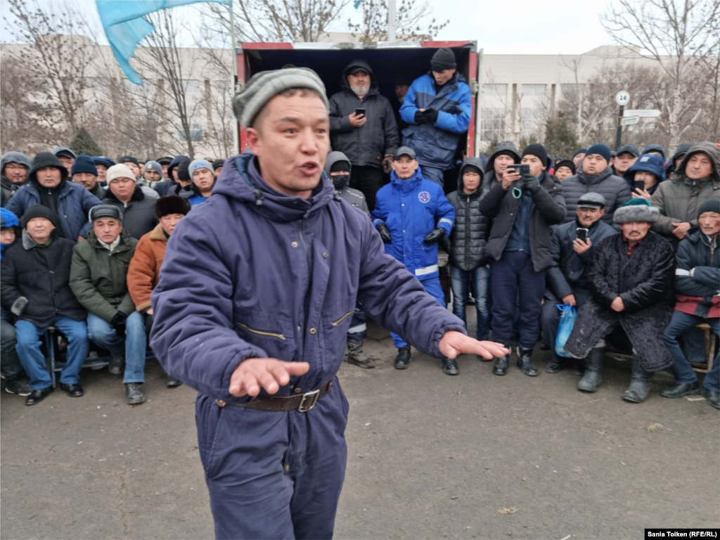 A man addresses a protest outside the mayor's office in Aqtau on January 5. 
