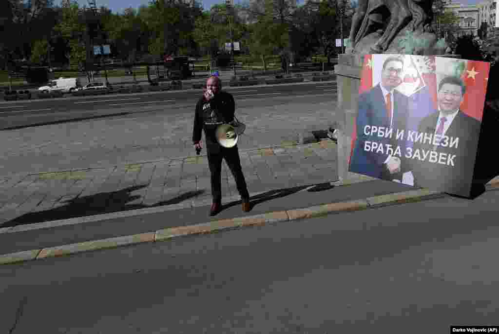 A protester outside Serbia’s National Assembly alongside a sign showing Serbian President Aleksandar Vucic and President Xi that reads, “Serbs And Chinese, Brothers Forever,” on April 28.   During a video summit this month, the EU announced a “robust economic investment” for Balkan countries, on top of the 3.3 billion euros ($3.6 billion) in emergency funding the EU had already earmarked for the region. “The Western Balkans belongs in the EU and there is no question for us about it,” European Commission President Ursula von der Leyen said after the summit.    