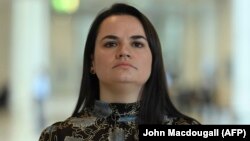 Belarusian opposition leader Svyatlana Tsikhanouskaya speaks to reporters after a meeting with Norbert Roettgen of Germany's conservative Christian Democratic Union (CDU) party, in Berlin on October 7.
