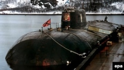 An undated photo of the ill-fated Kursk submarine at her mooring at a base of Vidyayevo, Russia.