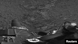 Tracks left by the "Curiosity" on Mars as seen in an image from the rover in late August