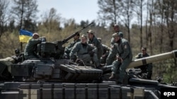 . На фото: військові України на українському танку Т-64БМ «Булат» під час міжнародних навчань за участю шести НАТО та країн-партнерів «Танковий виклик сильної Європи-2017». Німеччина, 11 травня 2017 року