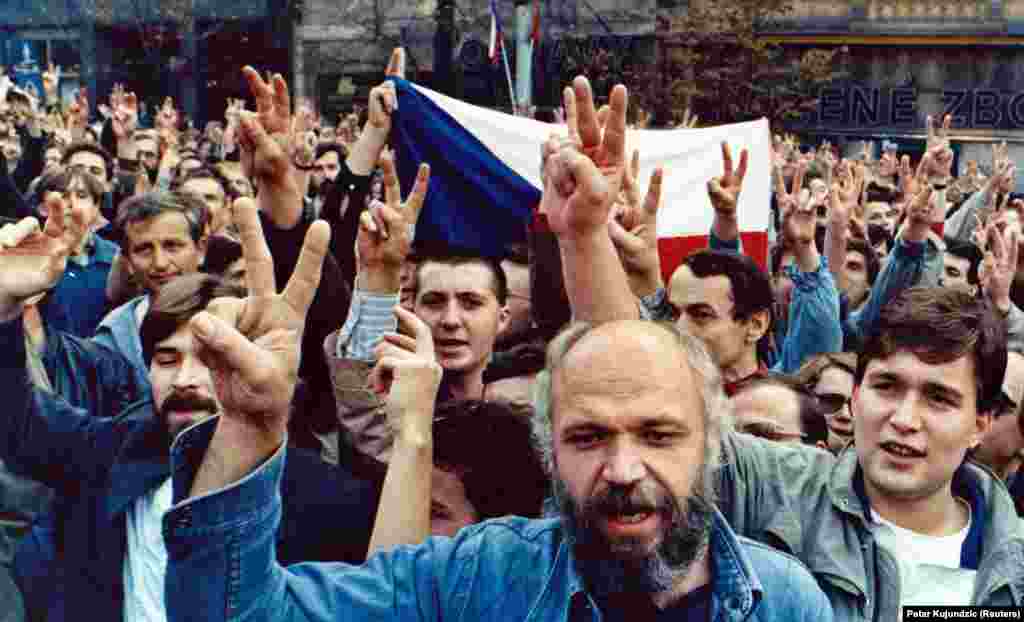 Demonstrators on Prague's Wenceslas Square flash victory signs as they demand freedom and democracy on October 28, 1989, the anniversary of the founding of Czechoslovakia in 1918.