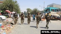 Afghan soldiers patrol in the city of Kunduz on June 25 which had been encircled by the Taliban.