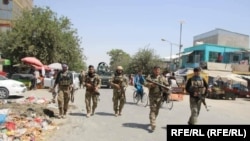 Afghan troops on patrol in the city of Kunduz on June 25.