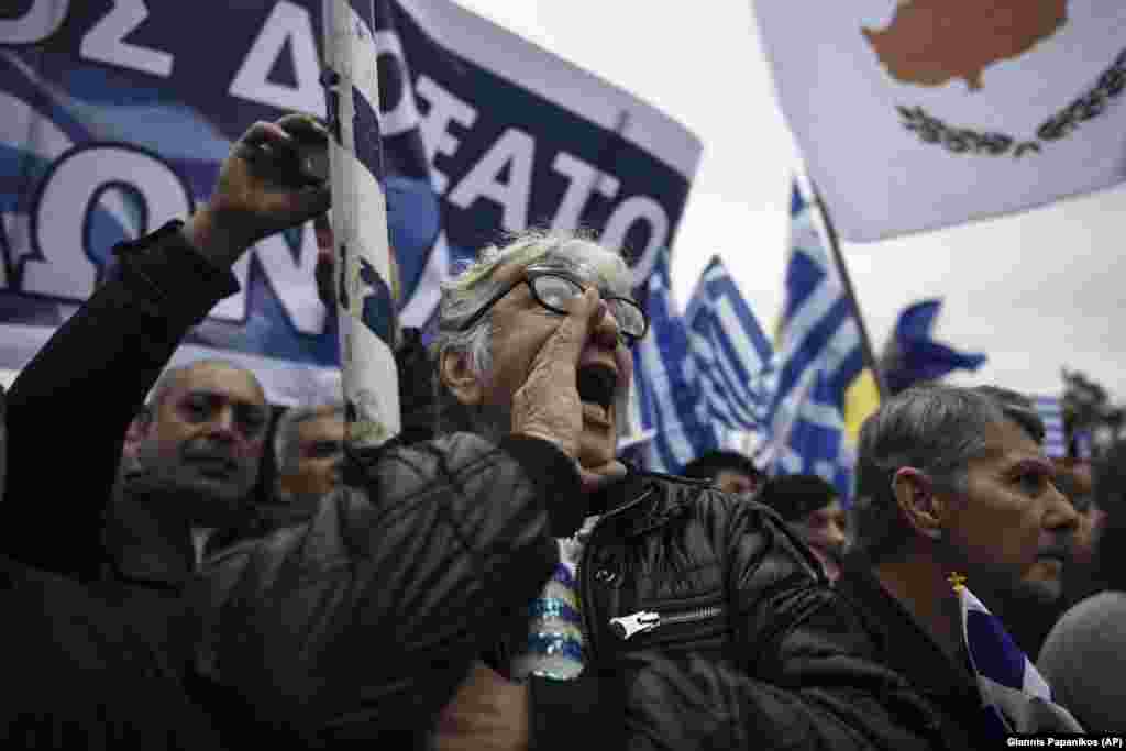 Greeks chant slogans during the protest that police say attracted 90,000 people. Reuters estimated the crowd at "hundreds of thousands."