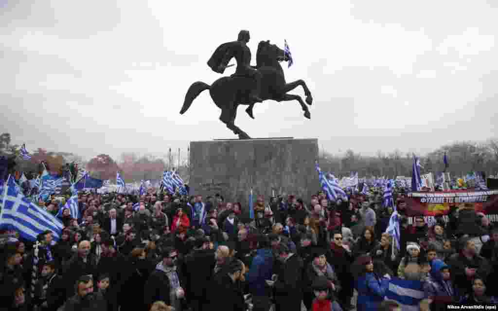 The crowd surrounds a statue of Alexander The Great during the Thessaloniki protest. Participants sang Greece's national anthem and held banners reading, "There is only one Macedonia and it is Greek!"
