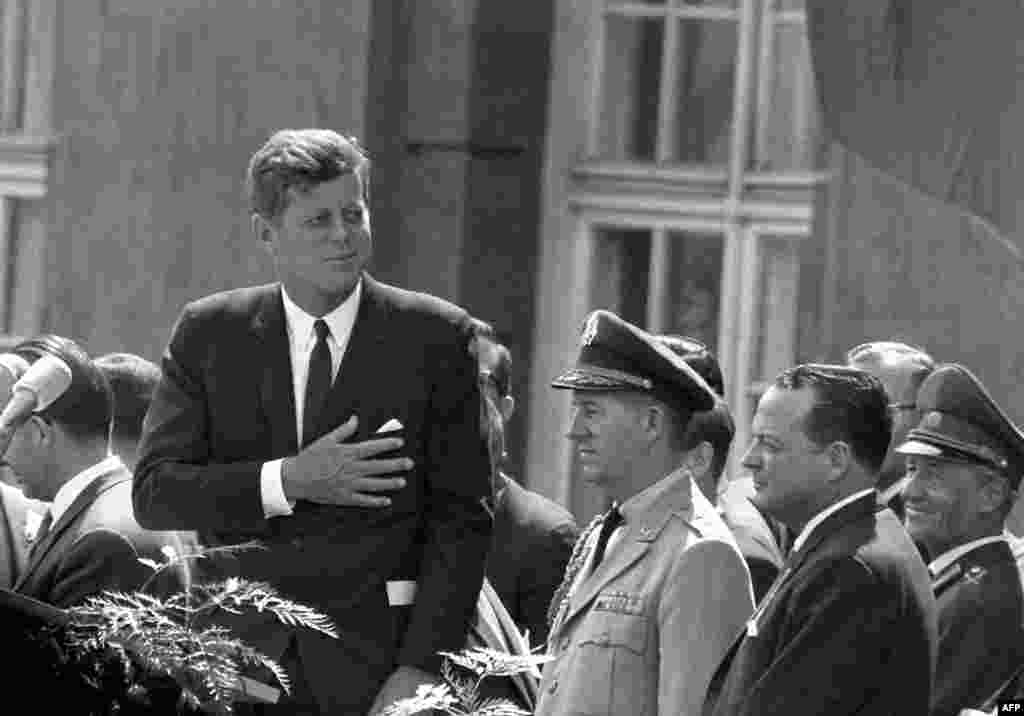 President Kennedy gives a speech at the Schoeneberg city hall in Berlin on June 26, 1963. It was here that he made his famous statement, "Ich bin ein Berliner" (I am a Berliner) to underscore U.S. support for West Germany and empathy for people living in the divided city of Berlin.