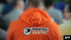 A delegate wears a sweatshirt with the Pirate Parties International (PPI) logo during their international conference in Prague earlier this month.