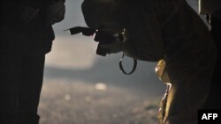 Следователи изучают место преступления в пригороде Сараево