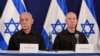 Israeli Prime Minister Benjamin Netanyahu (left) and then-Defense Minister Yoav Gallant attend a press conference in Tel Aviv in October 2023.
