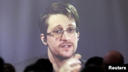 Edward Snowden speaks via video link during a conference at the University of Buenos Aires Law School in 2016.