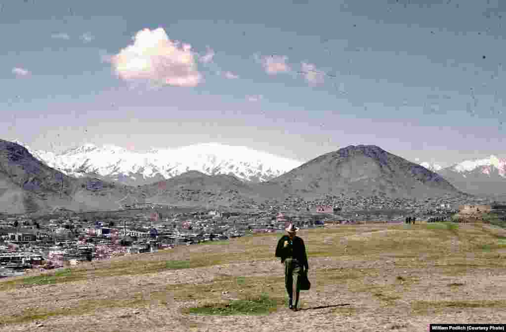 William Podlich strolls on a hillside outside of Kabul.