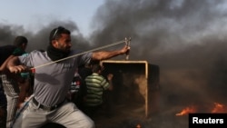 Прикордонні протести, як на цьому фото, стаються не рідше як раз на тиждень від весни 2018 року на кордоні Смуги Гази й Ізраїлю