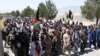 Civilians across Afghanistan are teaming up with security forces to push back the Taliban, such as in Khost Province on July 7.