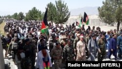 Civilians across Afghanistan are teaming up with security forces to push back the Taliban, such as in Khost Province on July 7.