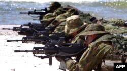 Литовські солдати під час військових навчань. Червень 2012 року