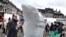 A WWF-sponsored artist carves an ice sculpture of a polar bear in Copenhagen to highlight the UN Climate Conference that is set to begin on December 7.