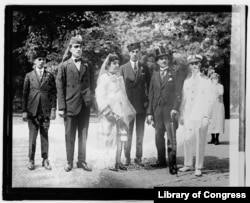 “Princess Fatima” with her three adult sons and another man (in top hat). In the white uniform is Stanley Jacob Weinberg, in character as U.S. official Rodney S. Wyman.