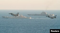 Royal Air Force Typhoons monitor Russian warships the Pyotr Veliky and the Admiral Kuznetsov (rear) as they pass near England on January 25.