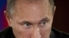 Putin Blasts Media's Qaddafi Coverage