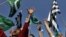 Supporters of Islamic parties hold party flags and shout slogans as they demand punishment for Aasia Bibi, the Christian woman sentenced to death for blasphemy, at a rally in Karachi last month.