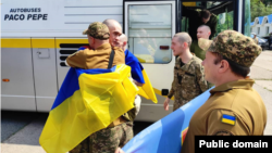Ukrainian soldiers returning as part of an exchange with Russia on June 9.