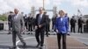 European Council President Antonio Costa, Britain's Prime Minister Keir Starmer and President of the European Commission Ursula von der Leyen walk during a visit to HMS Sutherland in central London, following the UK-EU Summit on May 19, 2025.