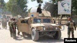 Afghan special forces gather at the battlefield amid clashes with the Taliban in Kunduz Province on June 22.